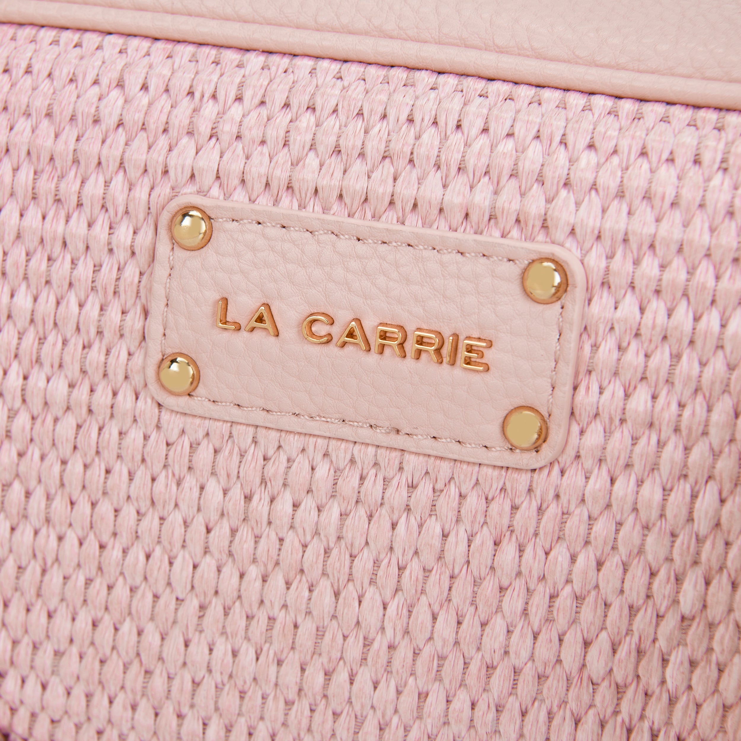 La Carrie La Plage sac bandoulière raphia rose clous