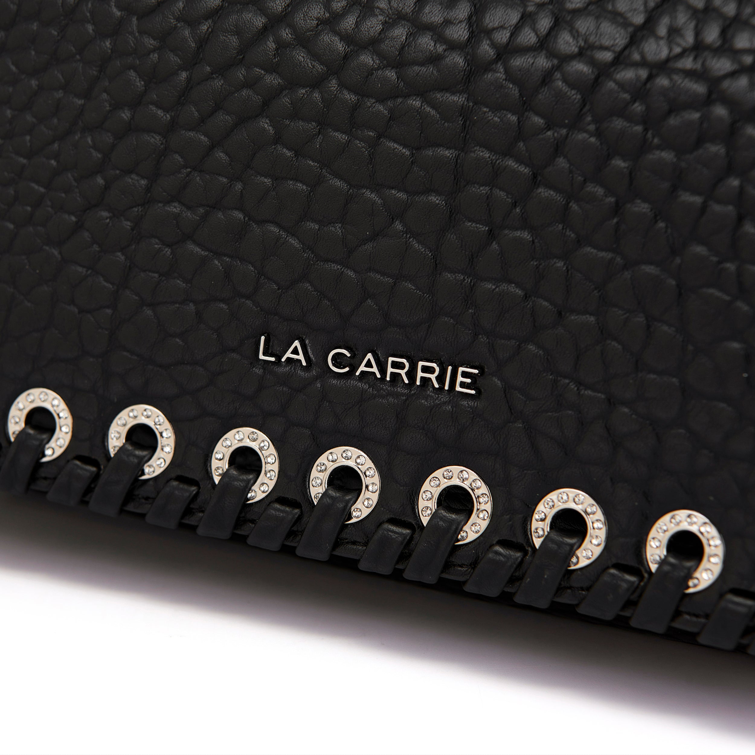 La Carrie Capsule sac bandoulière noir PU œillets